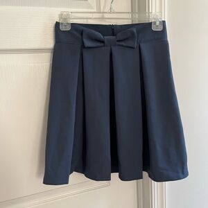 Bow pleated skirt